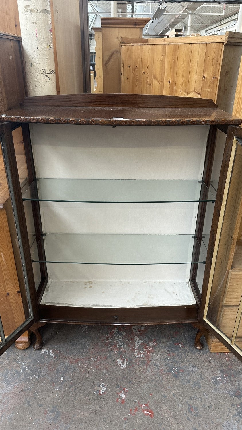 Early 20th century carved oak display cabinet with two glazed doors and cabriole supports