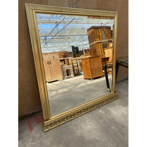 A GILT FRAMED BEVEL EDGE OVERMANTEL MIRROR 42 X 41 INCH