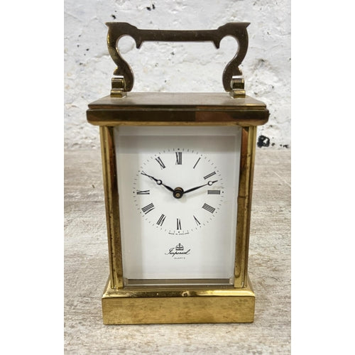 An Imperial brass cased quartz carriage clock - approx. 12cm high x 8cm wide x 6cm deep