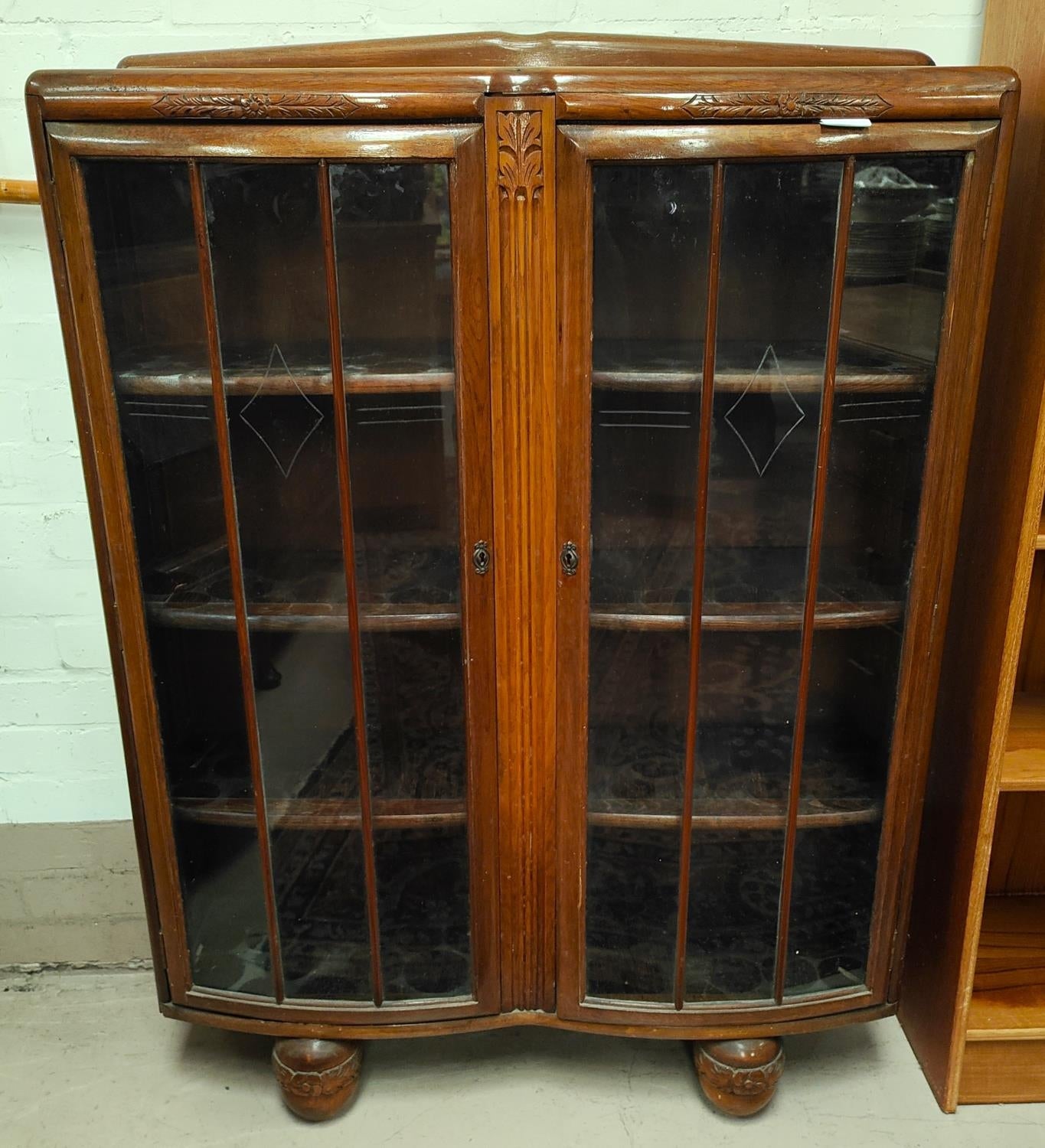 An Charming OAK double bow fronted display cabinet with carved decoration