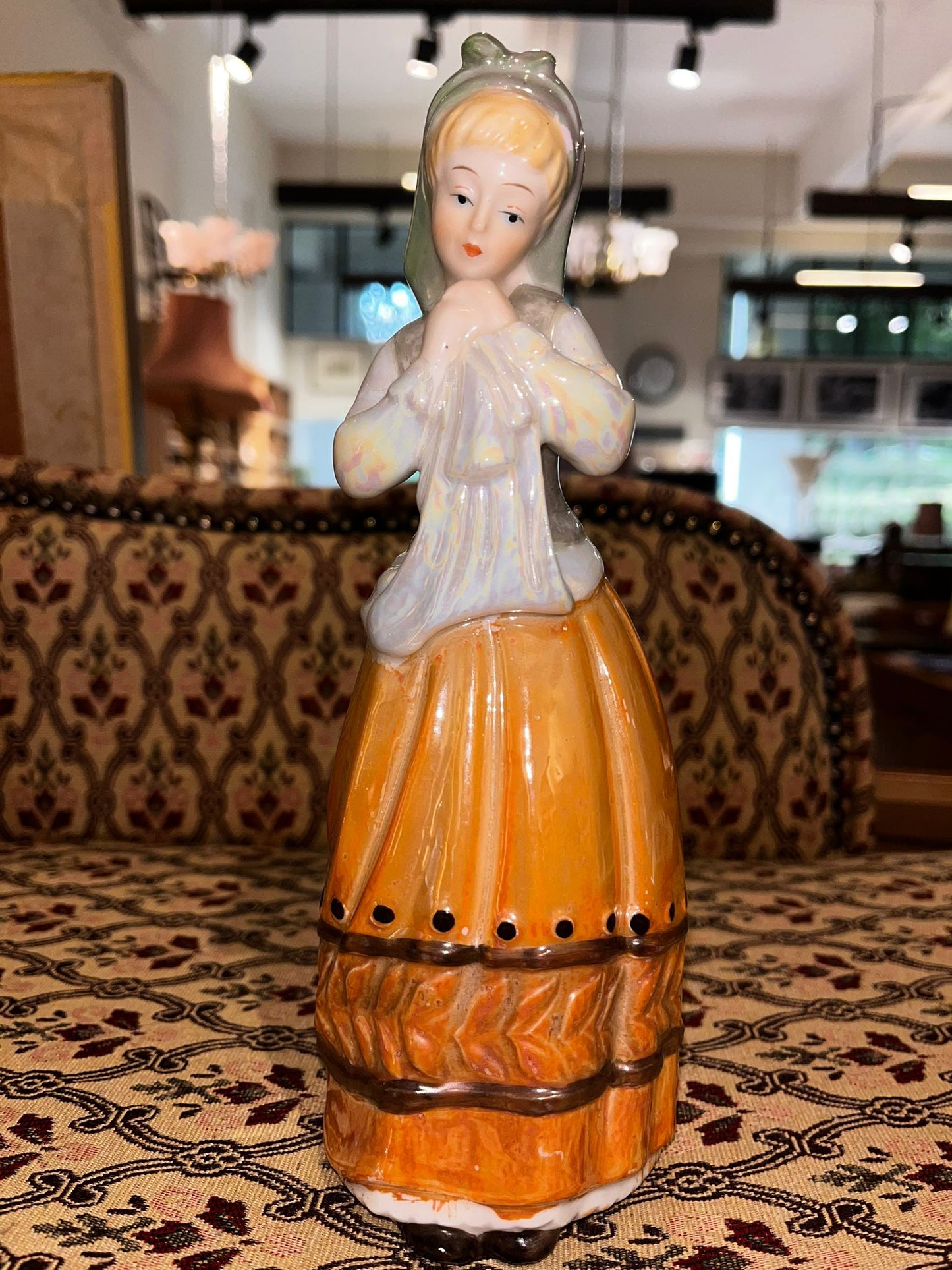 Glossy Ceramic Figurine: Traditional Lady with Apron and Orange Skirt