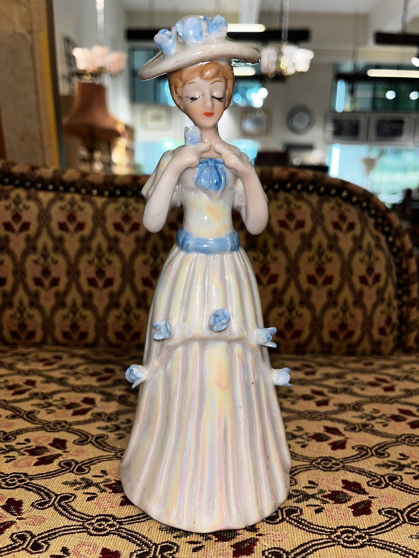 Iridescent Porcelain Lady Figurine with Blue Ribbons and Flowers