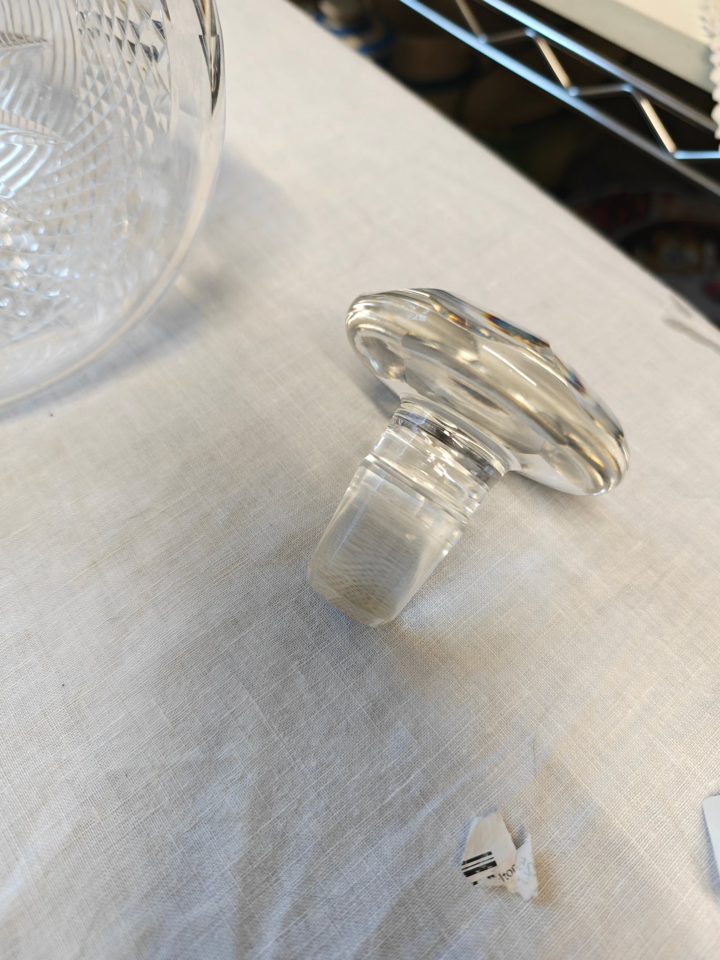 19th century crystal ships decanter with a diamond cut pattern on the base and a stepped prism design on the neck