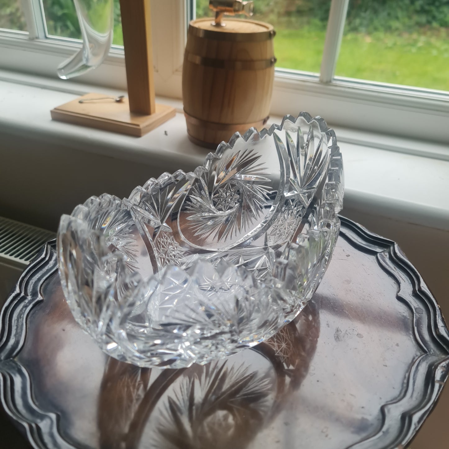 Lovely vintage heavy hand-cut crystal bowl with a starburst, pinwheel, and fan design.