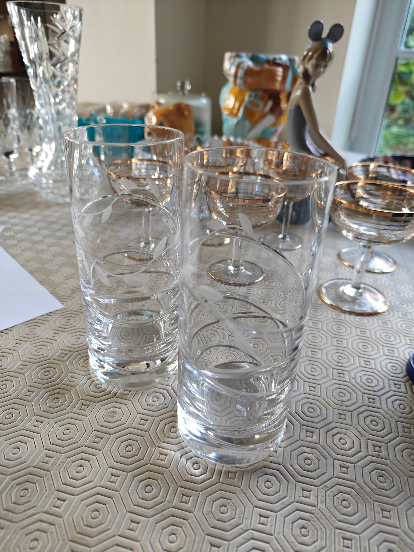 A pair of heavy bottom crystal glass with etching