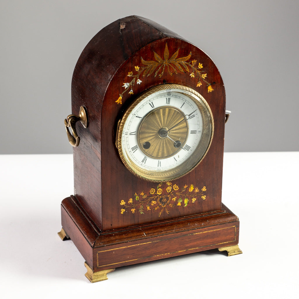 Regal Timepiece: Antique Mantle Clock on a Desk