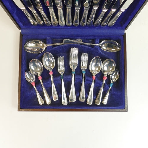 Vintage Cooper Ludlam stainless steel forty-four piece cutlery set, housed in a blue velvet-lined wooden cased box, with Rothmans Collection label on the box.