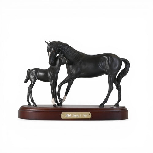 Royal Doulton Black Beauty & Foal matt finish presented on a wooden plinth. H:-18cm (without plinth)