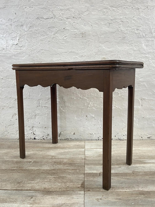 A George III mahogany fold over tea table - approx. 74cm high x 87cm wide x 42cm deep when closed