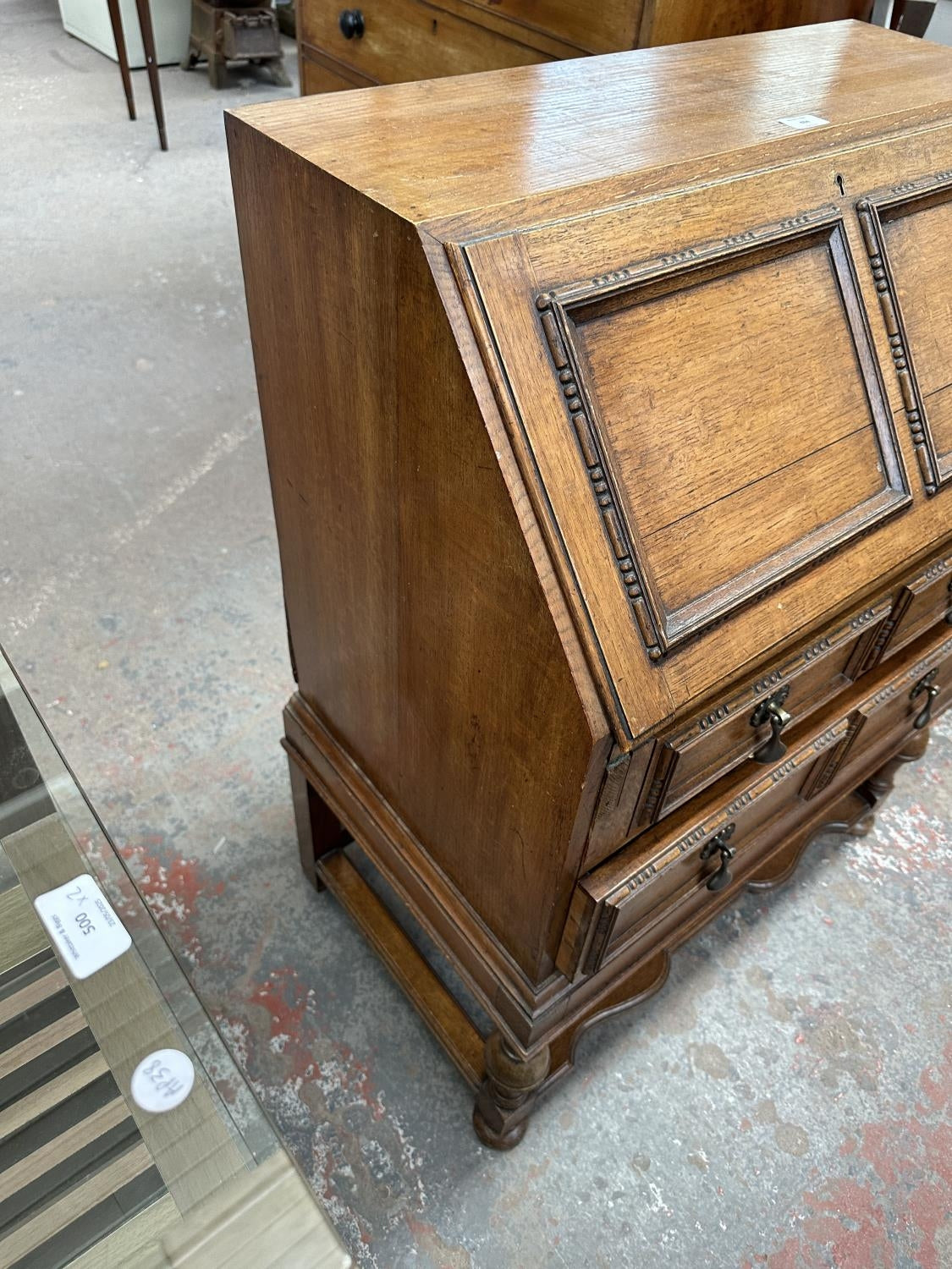 An early 20th century carved oak bureau - approx. 99cm high x 77cm wide x 45cm deep
