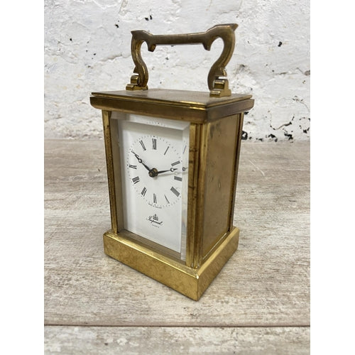 An Imperial brass cased quartz carriage clock - approx. 12cm high x 8cm wide x 6cm deep