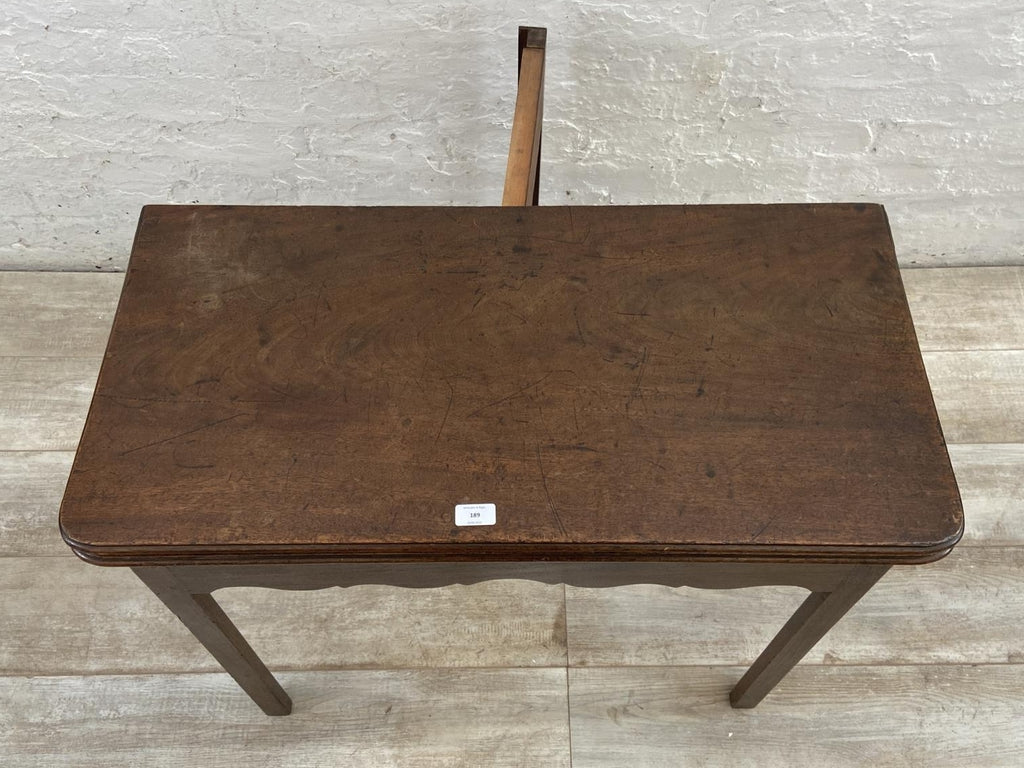 A George III mahogany fold over tea table - approx. 74cm high x 87cm wide x 42cm deep when closed