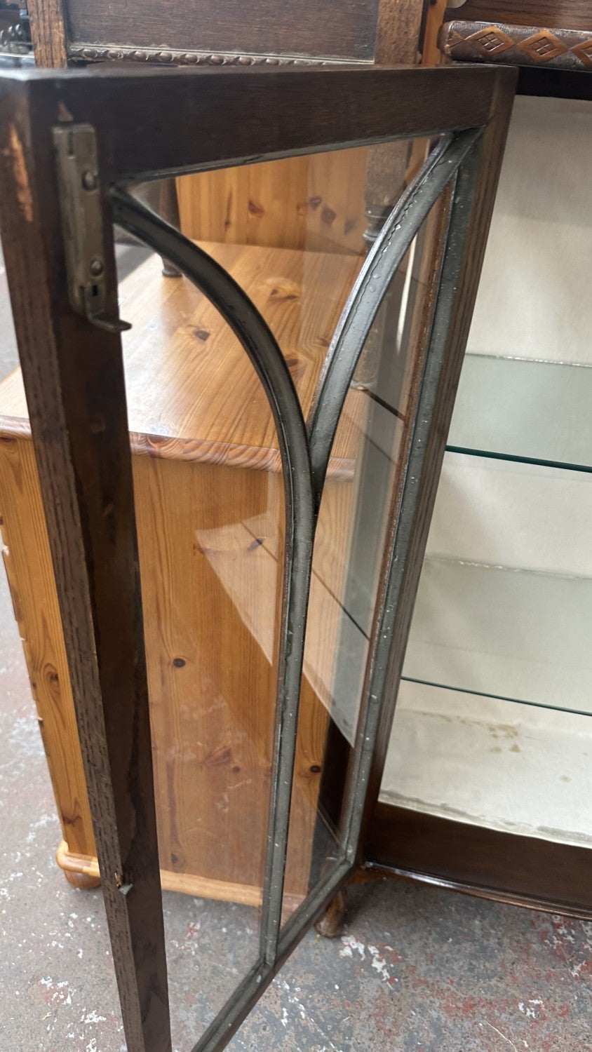 Early 20th century carved oak display cabinet with two glazed doors and cabriole supports