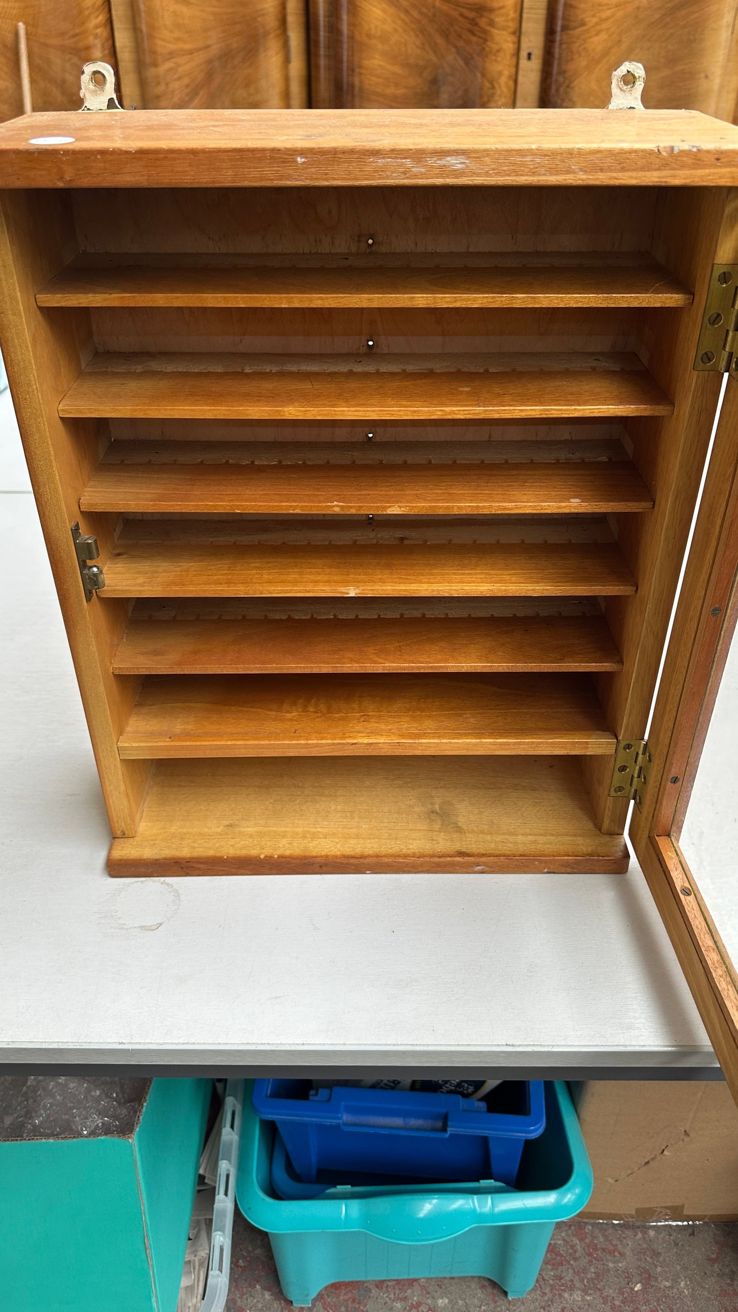 1970s beech wall hanging display cabinet with broad arrow mark to reverse -