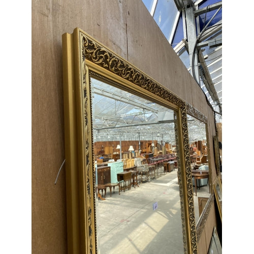 A VINTAGE GILT FRAMED WALL MIRROR WITH BEVEL EDGE, 45" X 35"