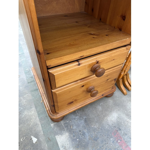 A PINE BEDSIDE CABINET WITH TWO DRAWERS