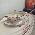 Elegant porcelain sauceboat is an antique Keller &amp; Guérin (K&amp;G) Lunéville sauceboat