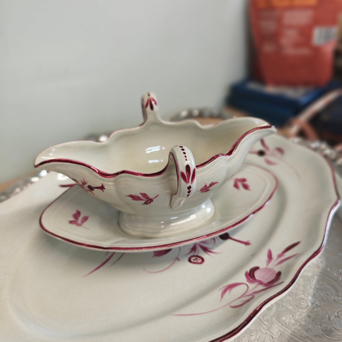 Elegant porcelain sauceboat is an antique Keller &amp; Guérin (K&amp;G) Lunéville sauceboat