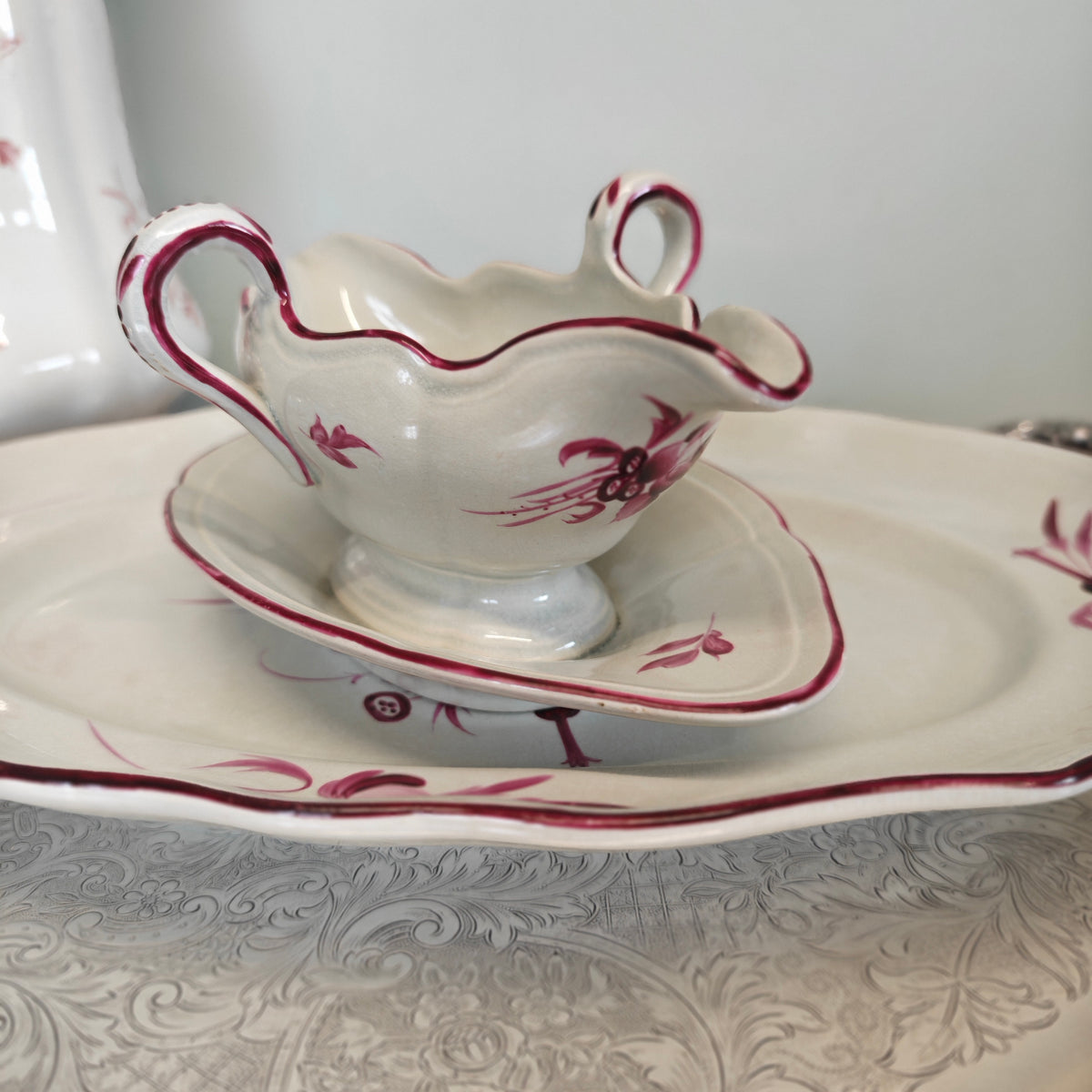Elegant porcelain sauceboat is an antique Keller &amp; Guérin (K&amp;G) Lunéville sauceboat