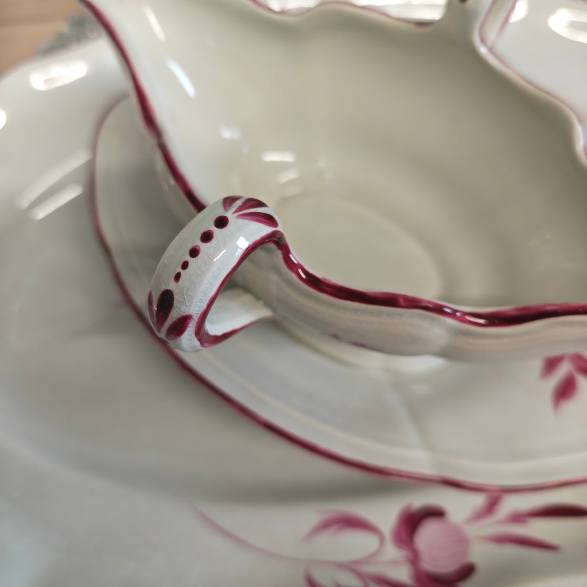 Elegant porcelain sauceboat is an antique Keller &amp; Guérin (K&amp;G) Lunéville sauceboat