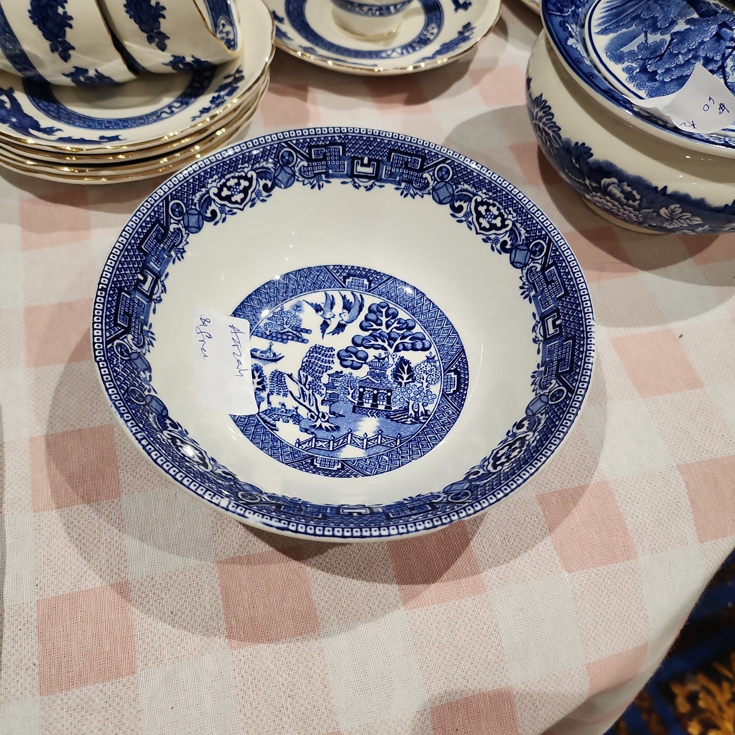 Blue and white willow  bowl with minor defect