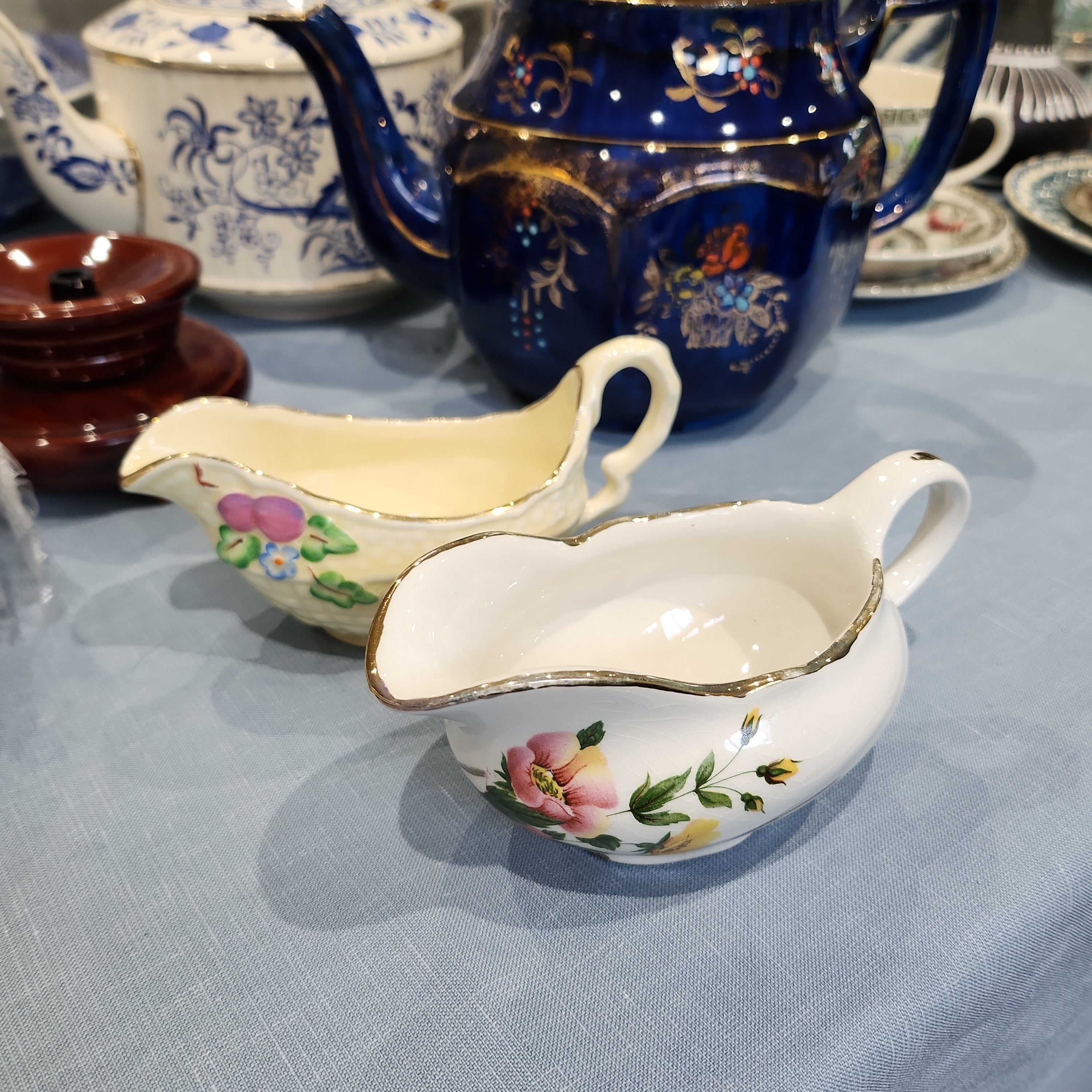 A pair of vintage cute snall gravy bowl