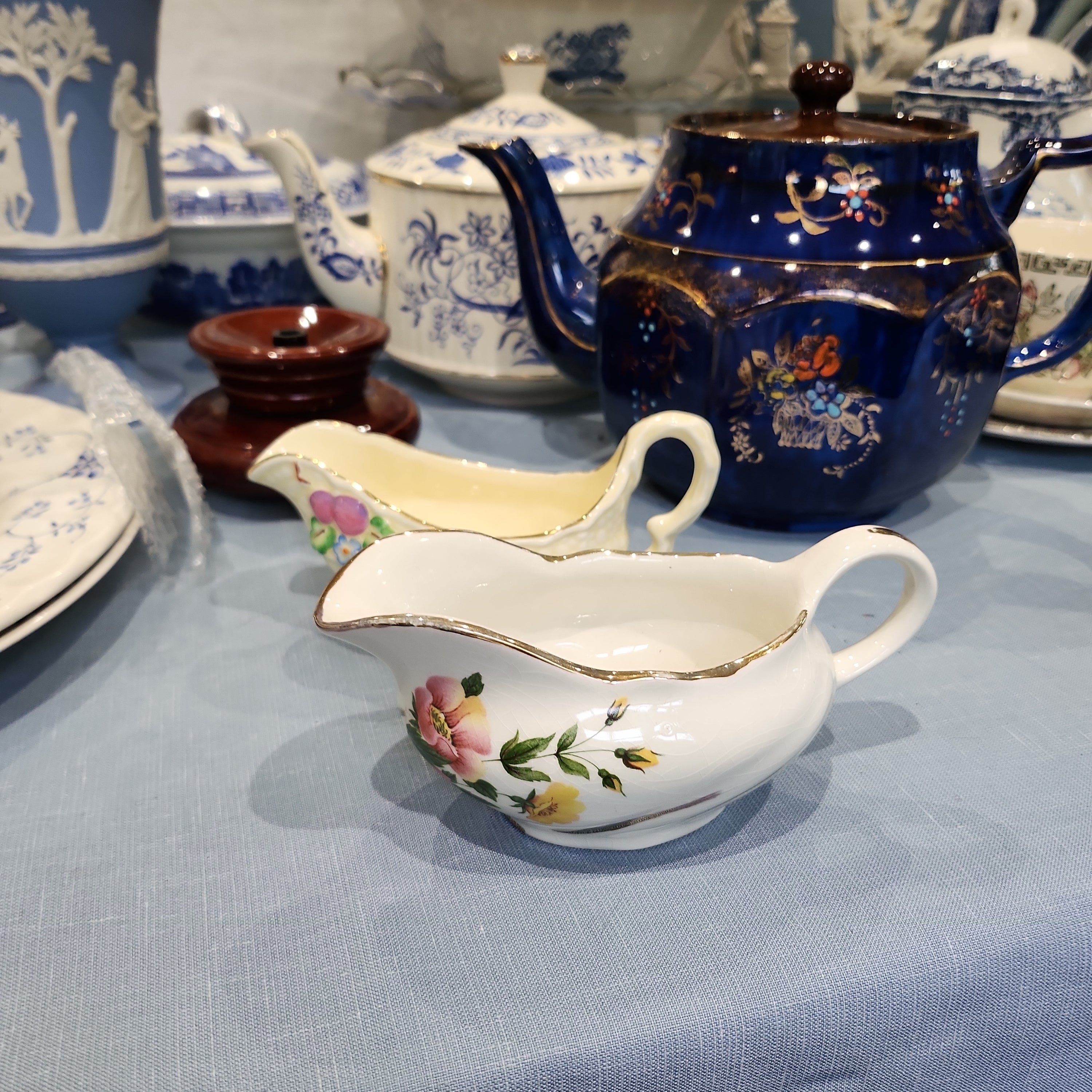 A pair of vintage cute snall gravy bowl