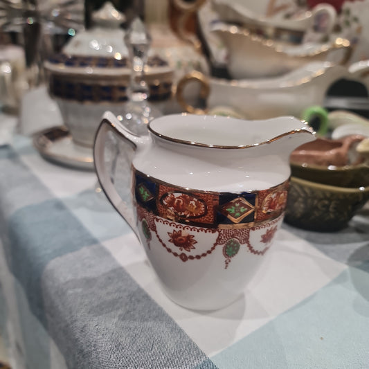 Antique handpainted imari milk jug - orange crown stamp