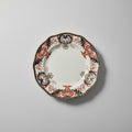 Decorative plate with intricate patterns on a gray background