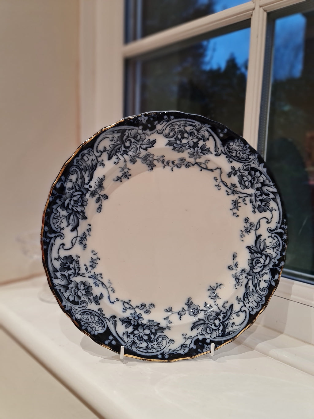 An antique plate in dark cobalt blue and white plate.  England1900, by Keeling & Co