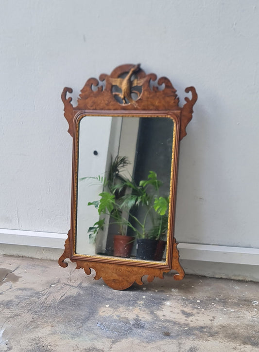 George II fretted walnut wall mirror.

Good colour to the well figured walnut frame bordering the carved gilt wood slip, original Mercury glass plate.

English 1740s.

H:59 W:34 D:1 CM