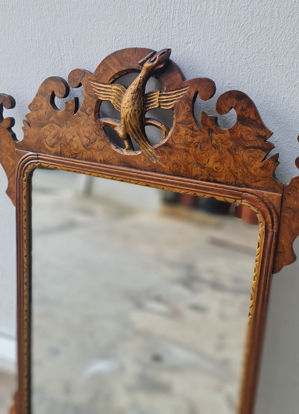 George II fretted walnut wall mirror.

Good colour to the well figured walnut frame bordering the carved gilt wood slip, original Mercury glass plate.

English 1740s.

H:59 W:34 D:1 CM