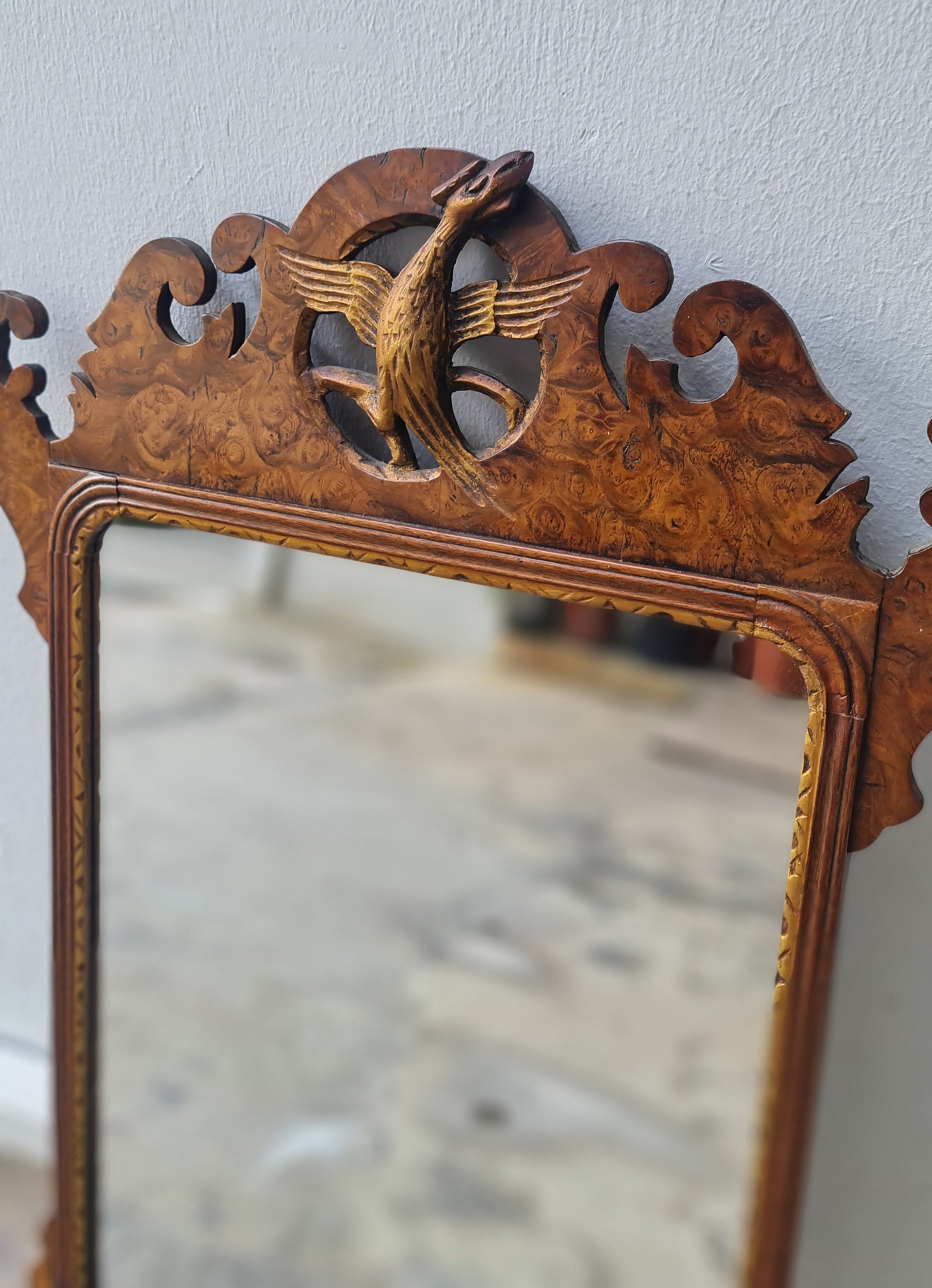 George II fretted walnut wall mirror.

Good colour to the well figured walnut frame bordering the carved gilt wood slip, original Mercury glass plate.

English 1740s.

H:59 W:34 D:1 CM