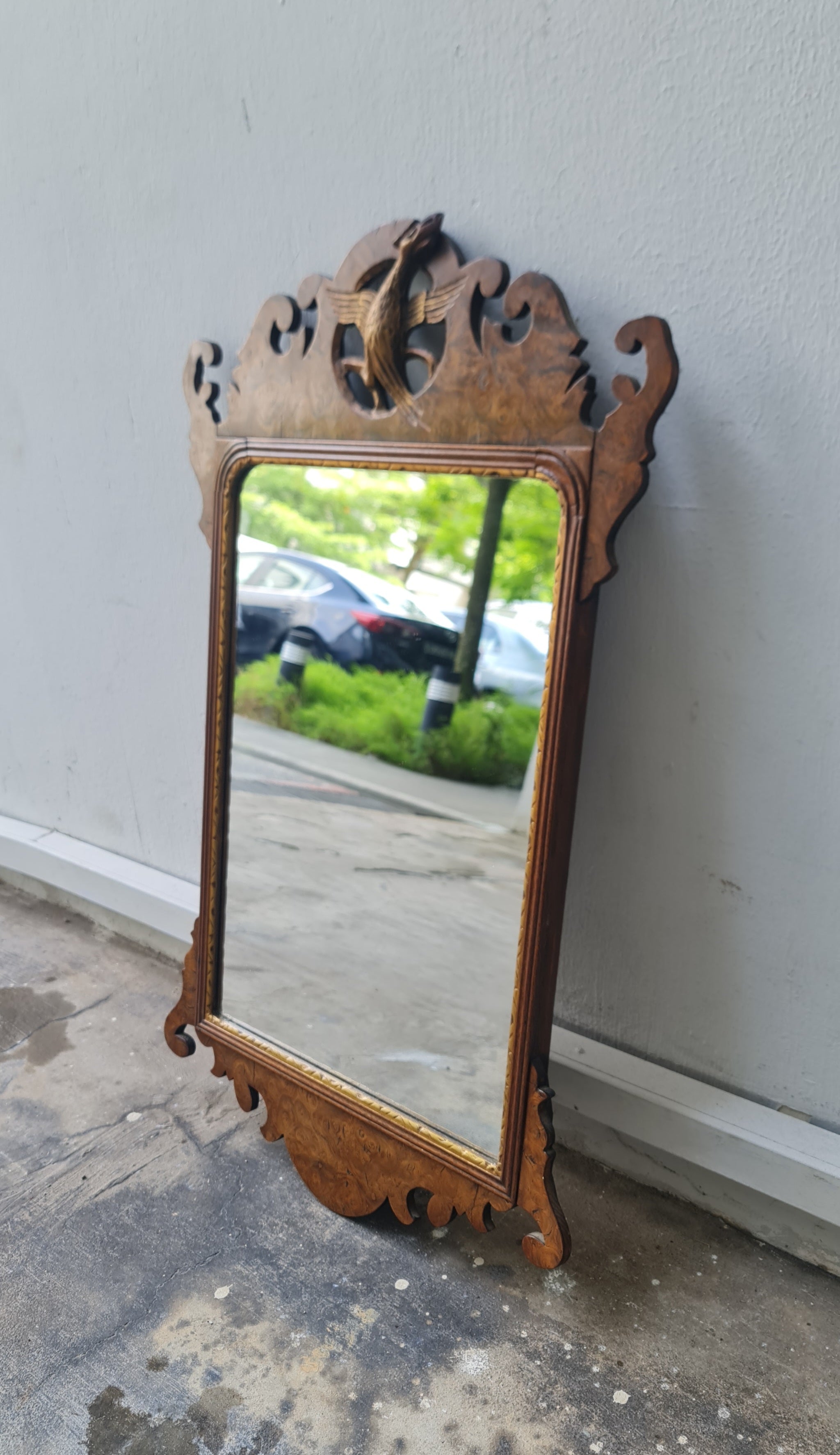 George II fretted walnut wall mirror.

Good colour to the well figured walnut frame bordering the carved gilt wood slip, original Mercury glass plate.

English 1740s.

H:59 W:34 D:1 CM