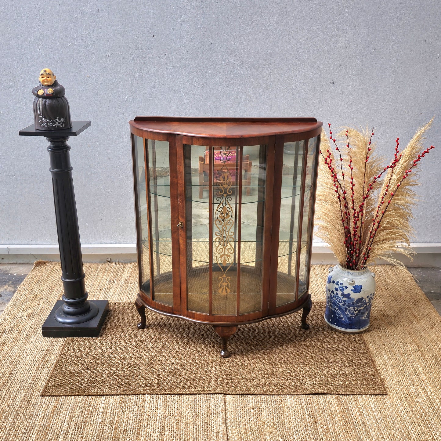 Antique bow front display cabinet with lnlay