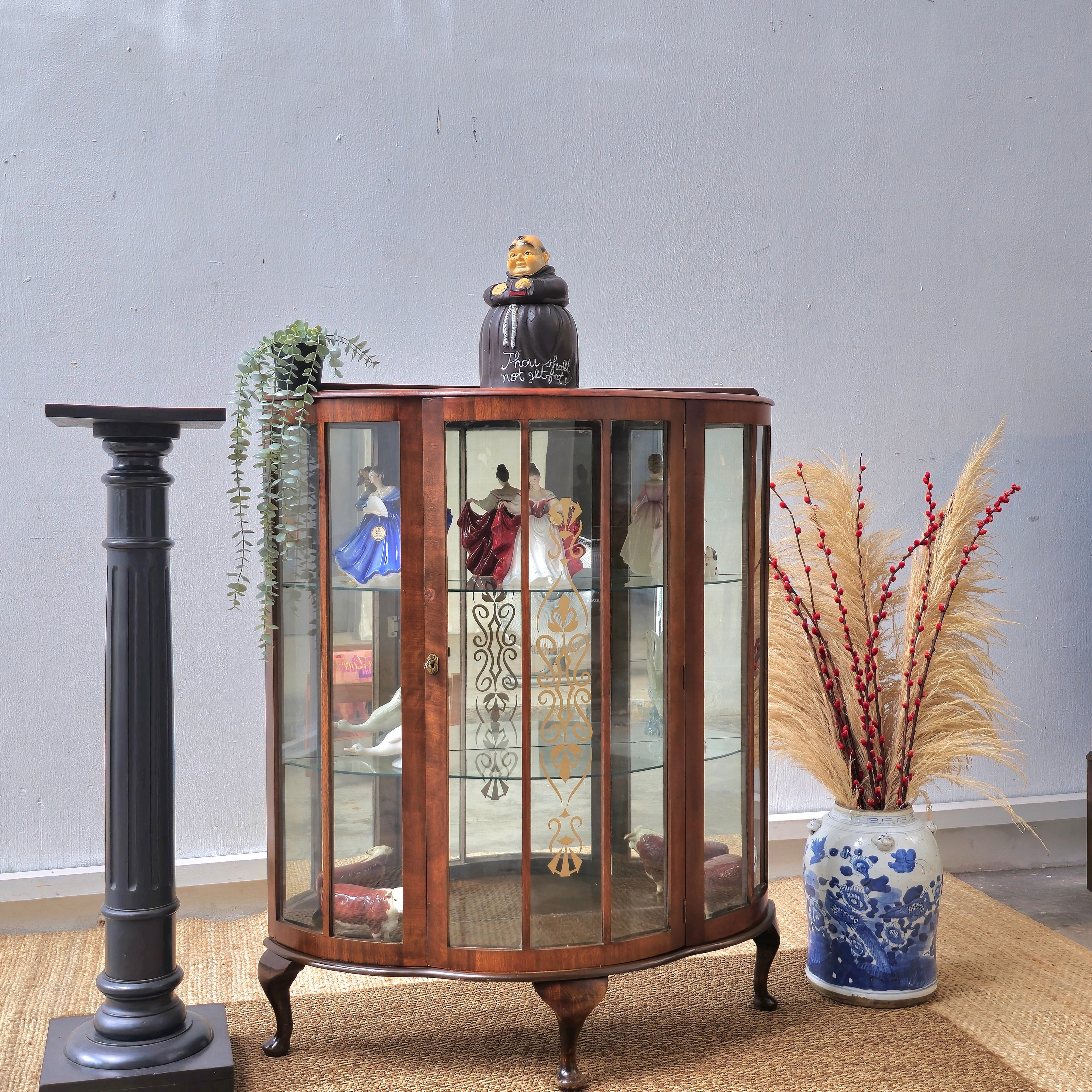 Antique bow front display cabinet with lnlay