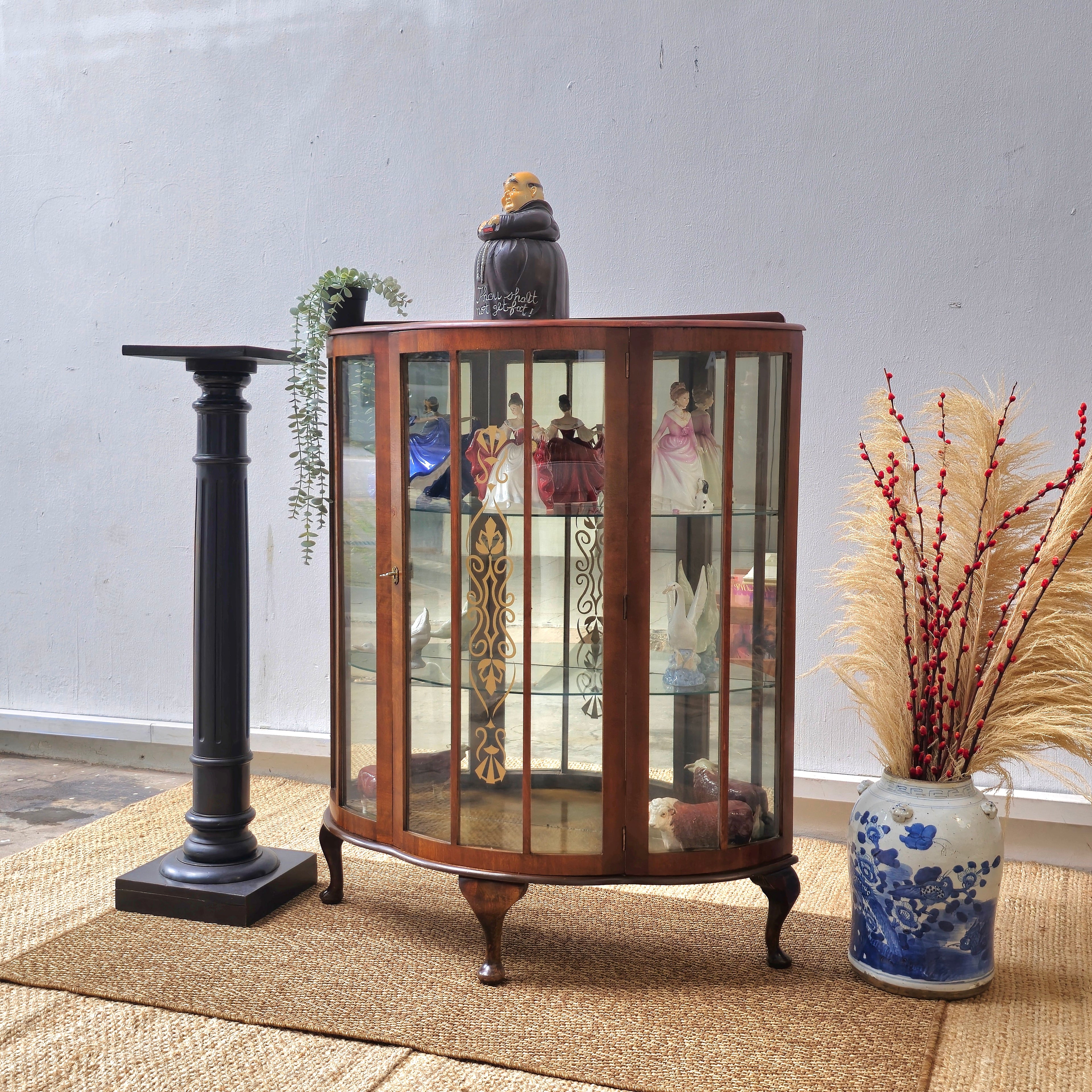 Antique bow front display cabinet with lnlay