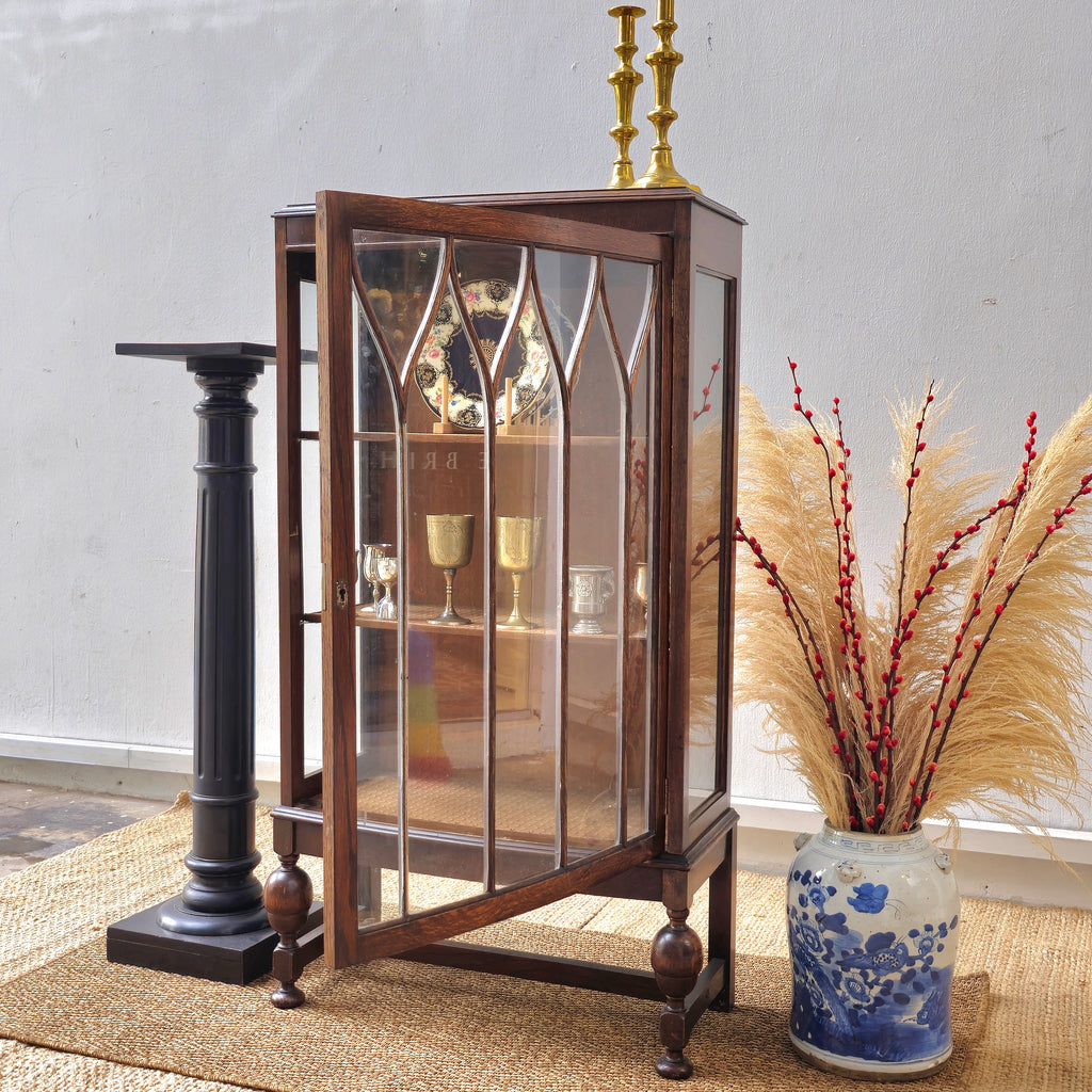 Antique oak display cabinet with gothic style leaded glass