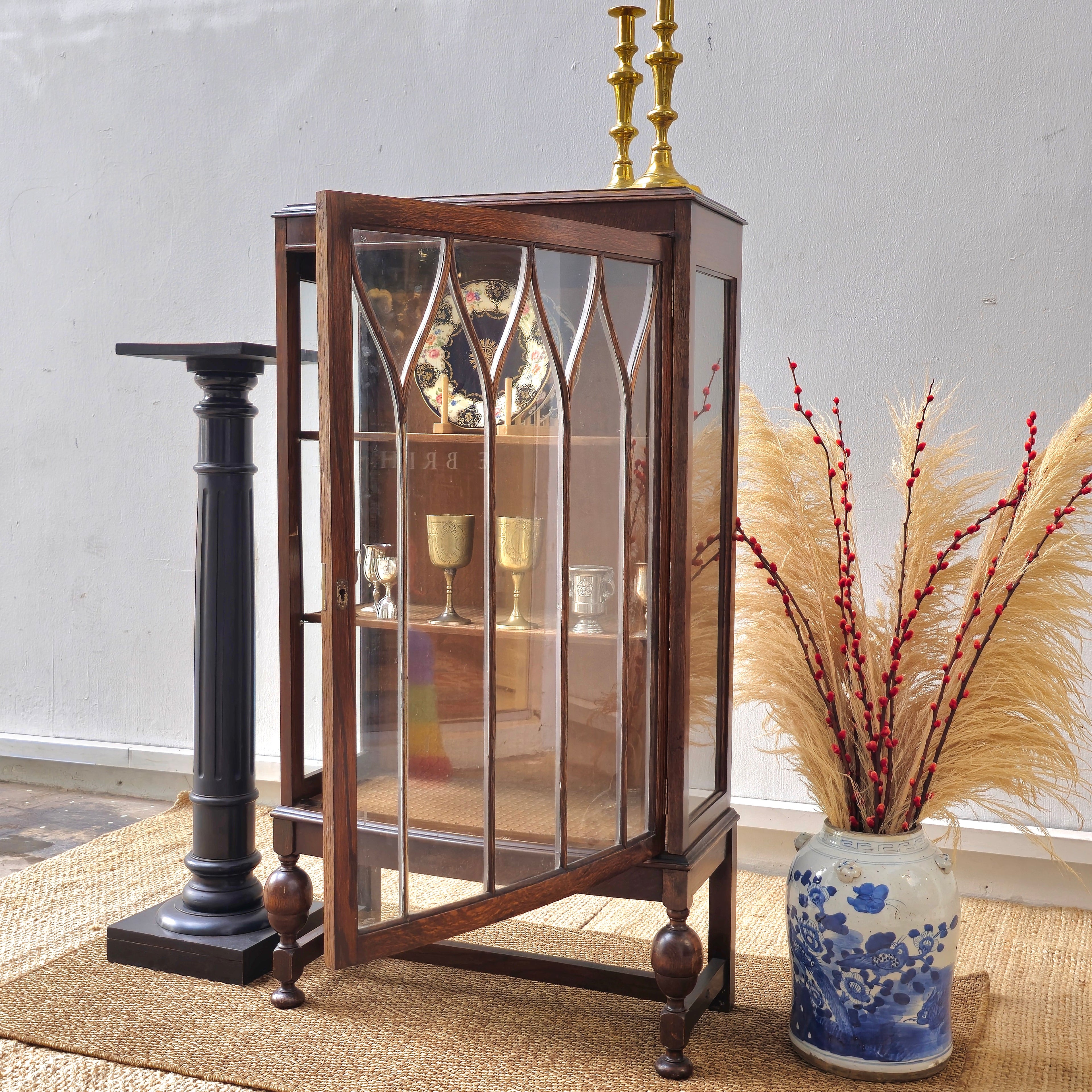 Antique oak display cabinet with gothic style leaded glass