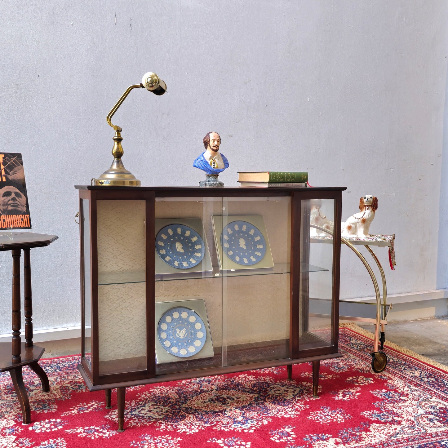 A Hubbinet 1960's glass display cabinet