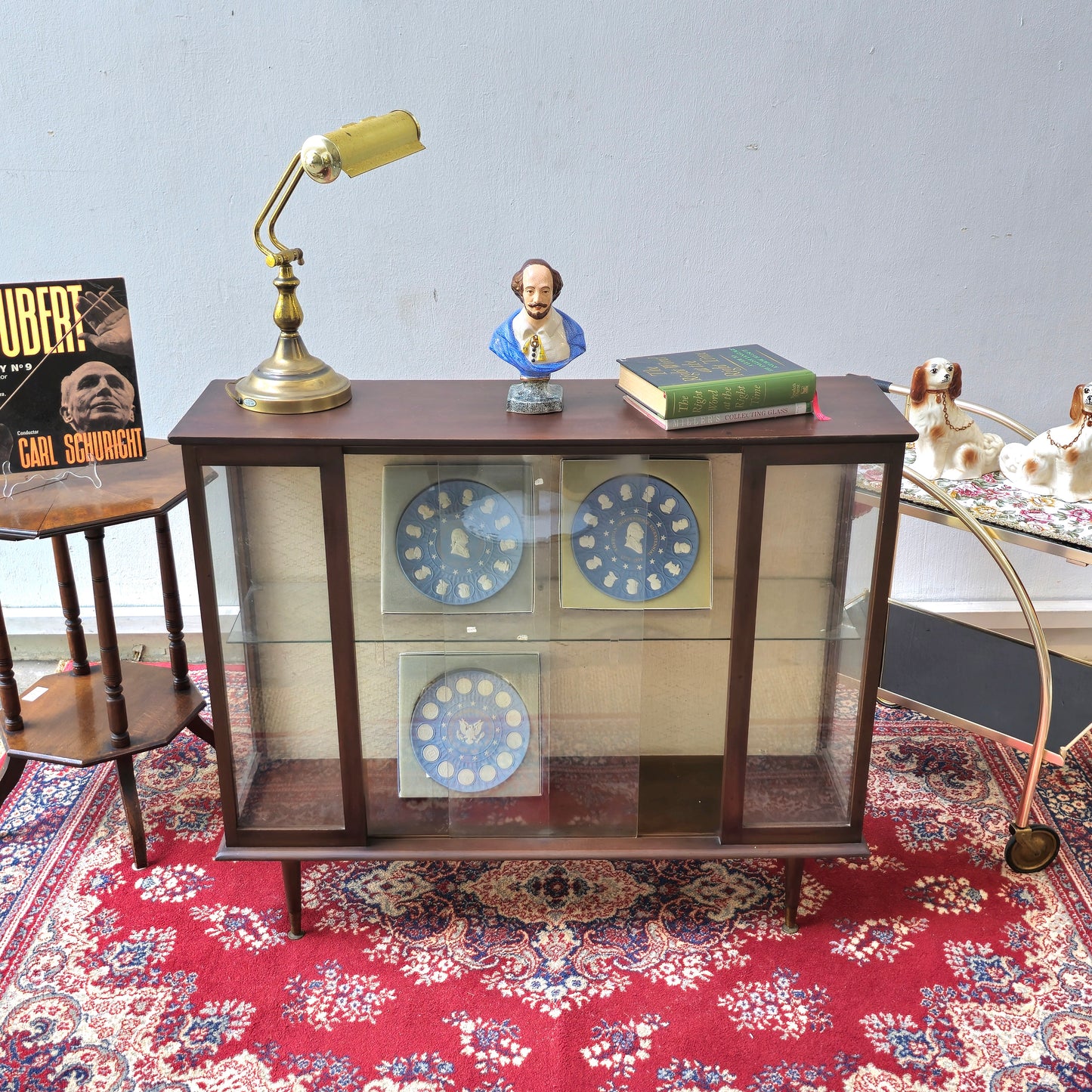 A Hubbinet 1960's glass display cabinet