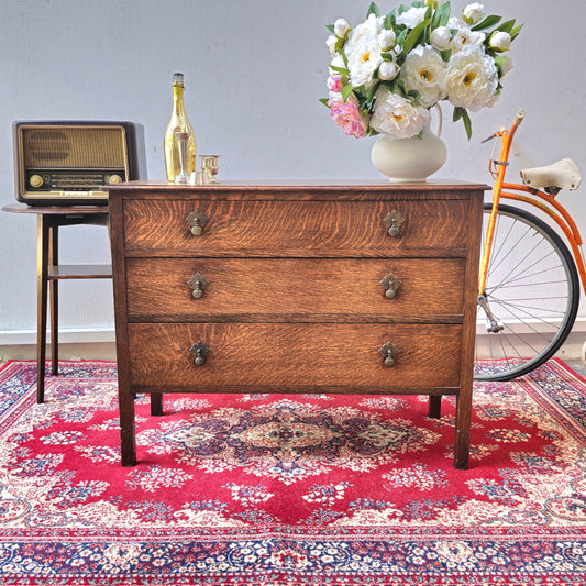 A 1930's Oak chest of 4 long drawers