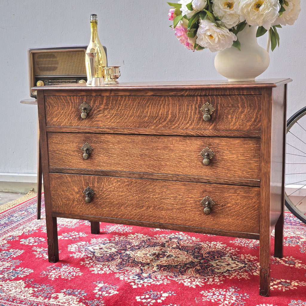 A 1930's Oak chest of 4 long drawers