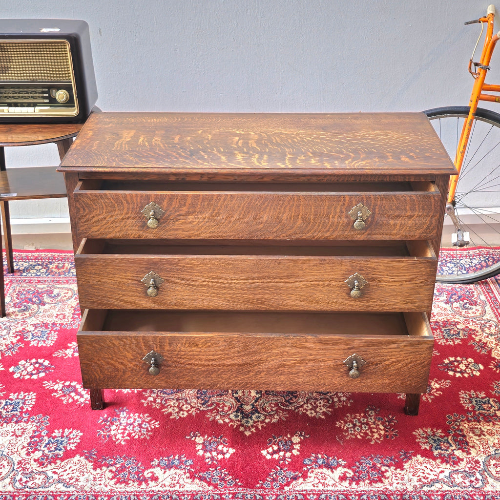 A 1930's Oak chest of 4 long drawers