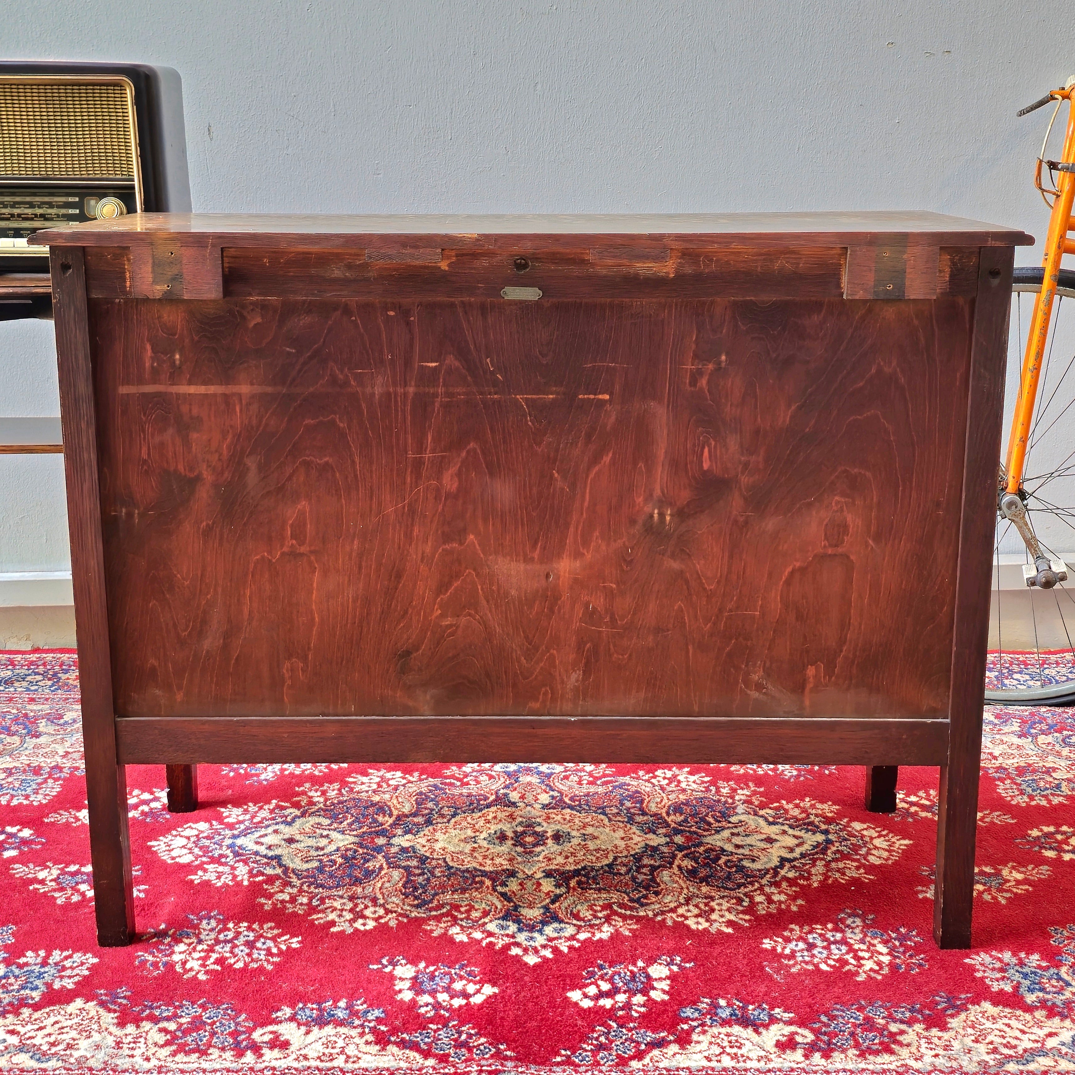 A 1930's Oak chest of 4 long drawers