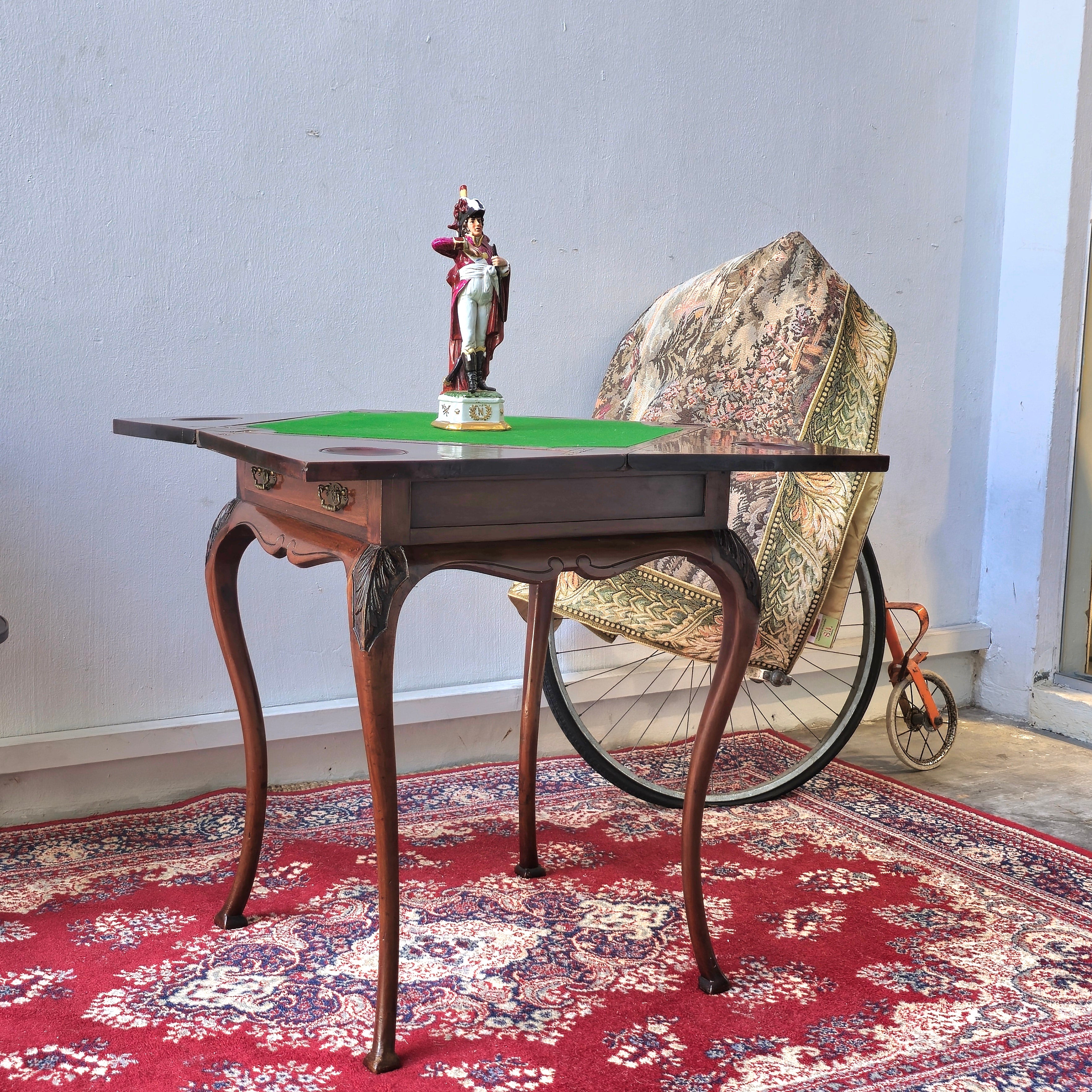 Antique folding card table with green felt top