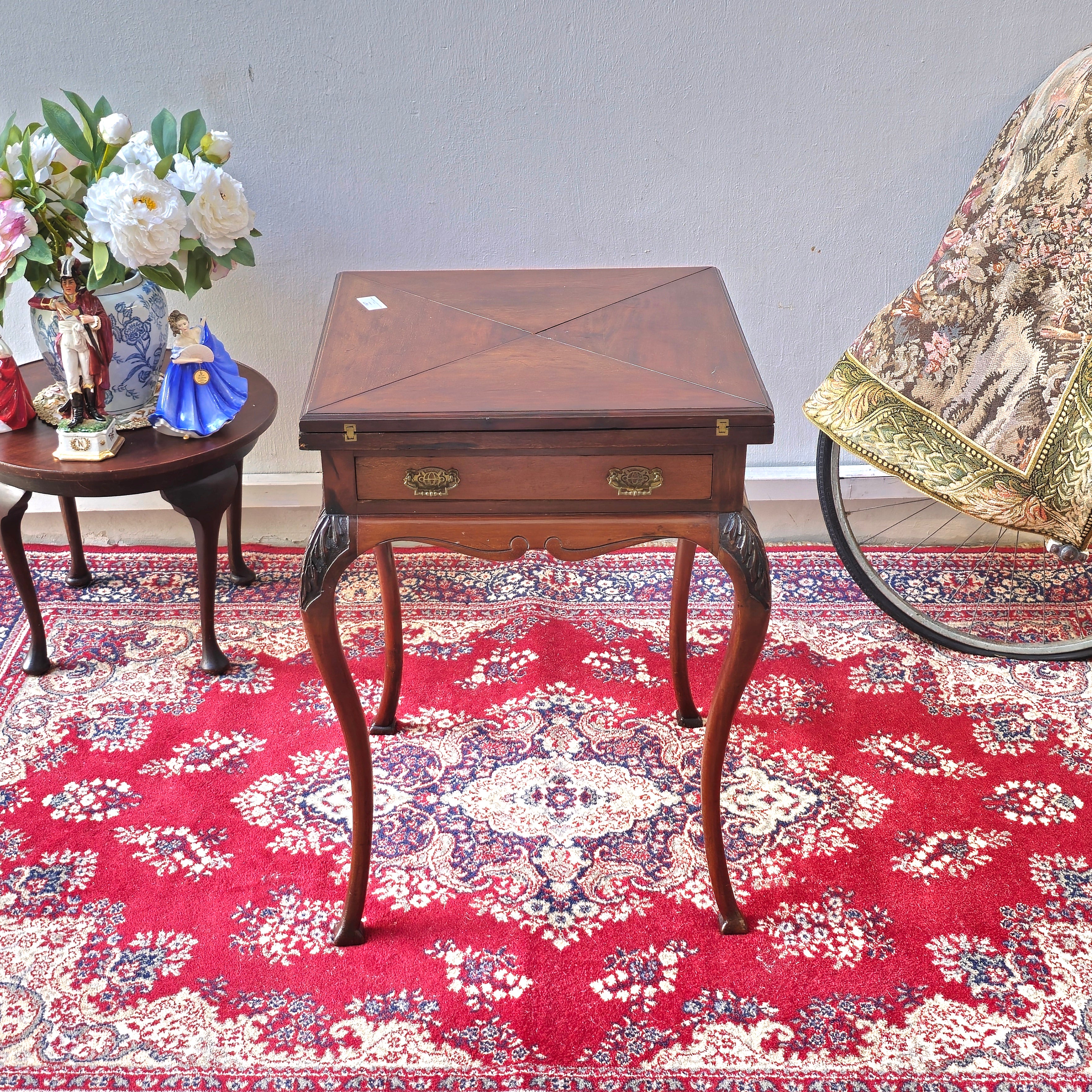 Antique folding card table with green felt top