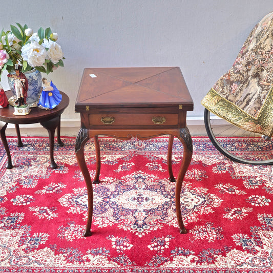 Antique folding card table with green felt top