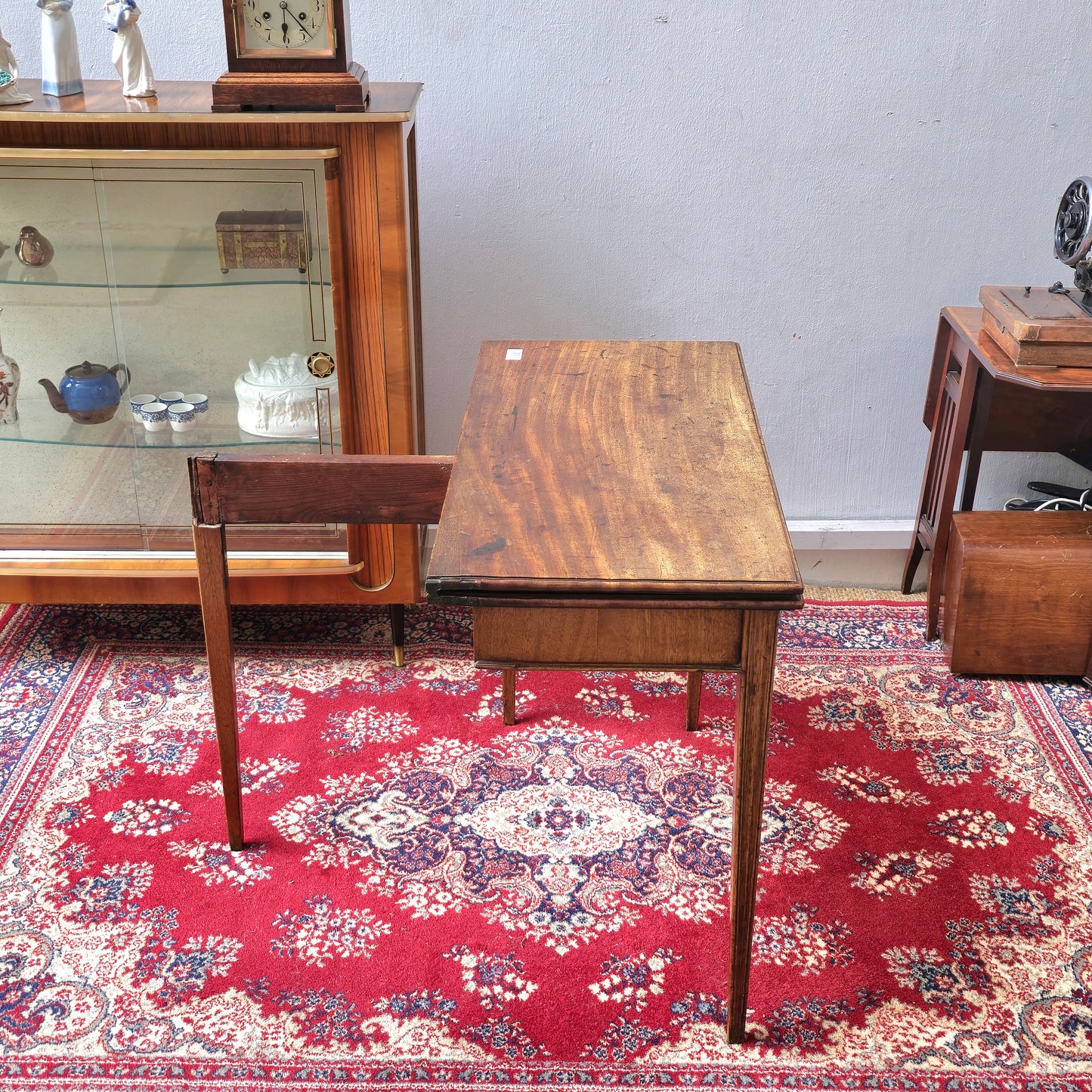 19th Century mahogany fold over tea table, fitted with a small drawer