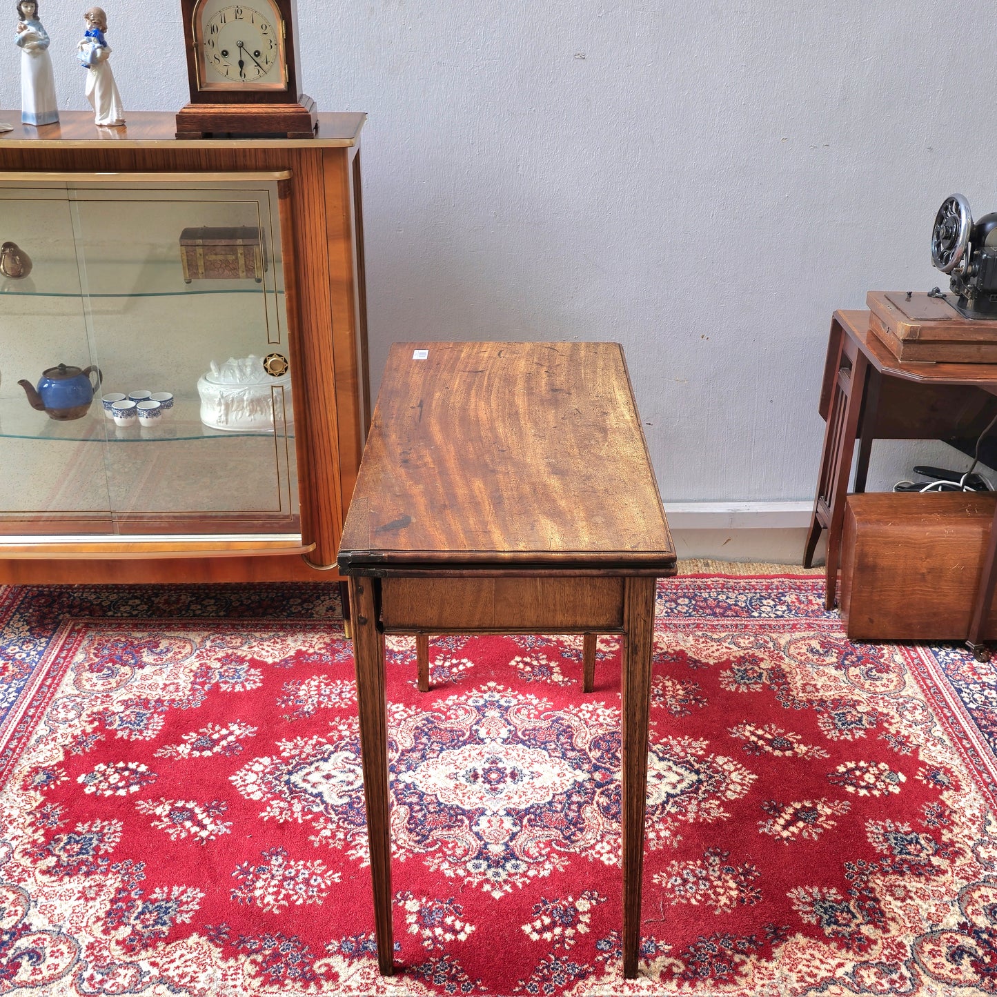 19th Century mahogany fold over tea table, fitted with a small drawer
